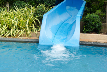 This is a picture of a swimming pool slide in a clean pool in Amarillo, Texas.