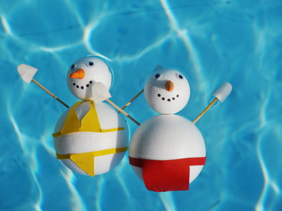 This is a picture of two snowmen in a pool to discuss pool winterization in Amarillo, Texas.